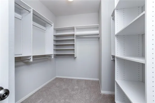 a view of an empty walk in closet