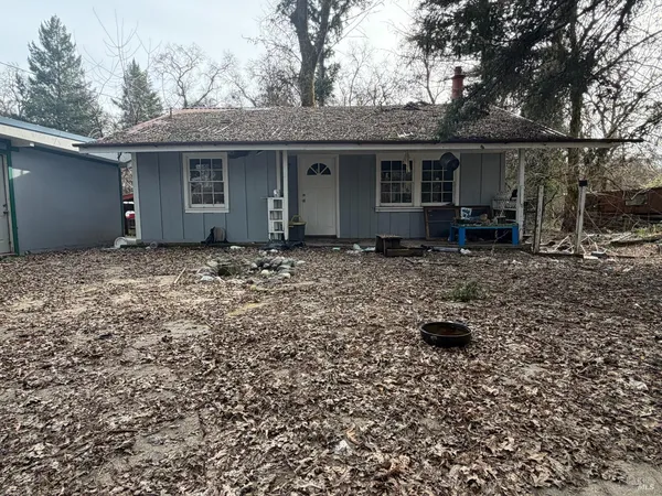 a house with trees in the background