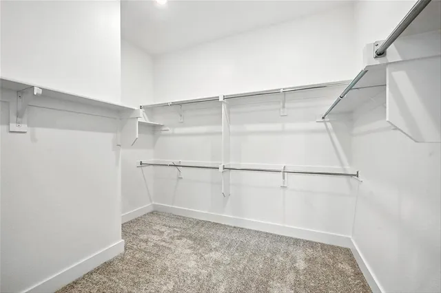 a view of an empty walk in closet