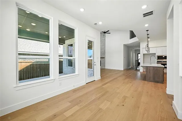 a view of a kitchen with a sink and cabinets