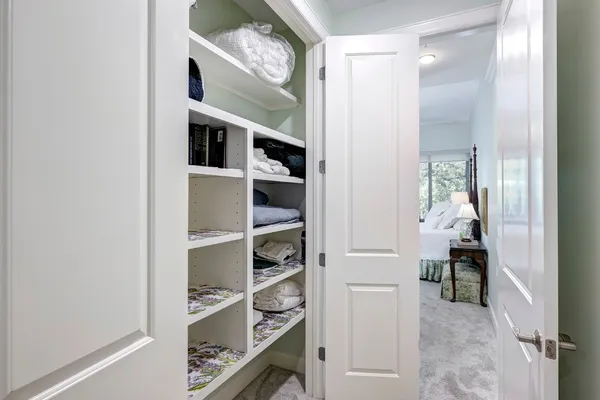 a view of hallway with walk in closet