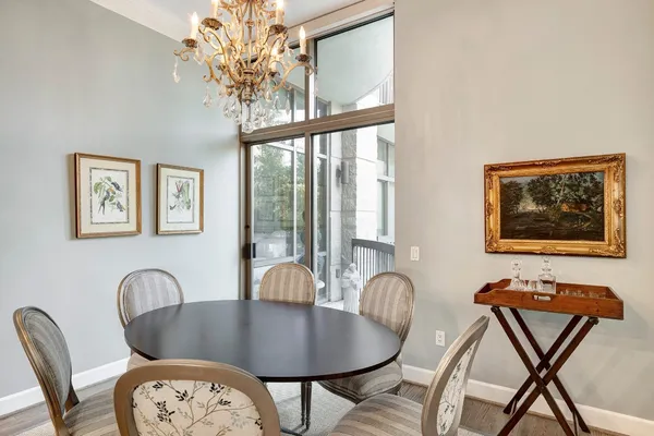 a dining room with furniture and window