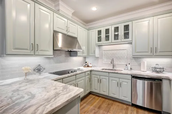 a kitchen with a sink and cabinets