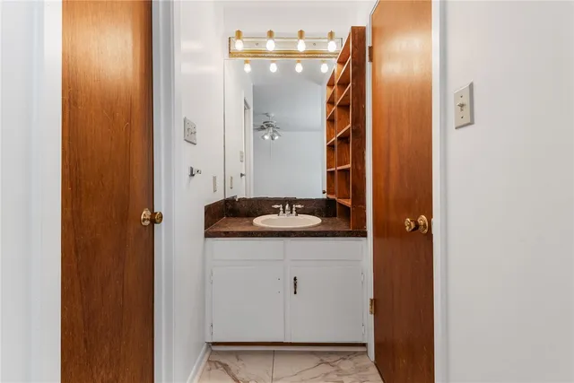 a bathroom with a sink and mirror