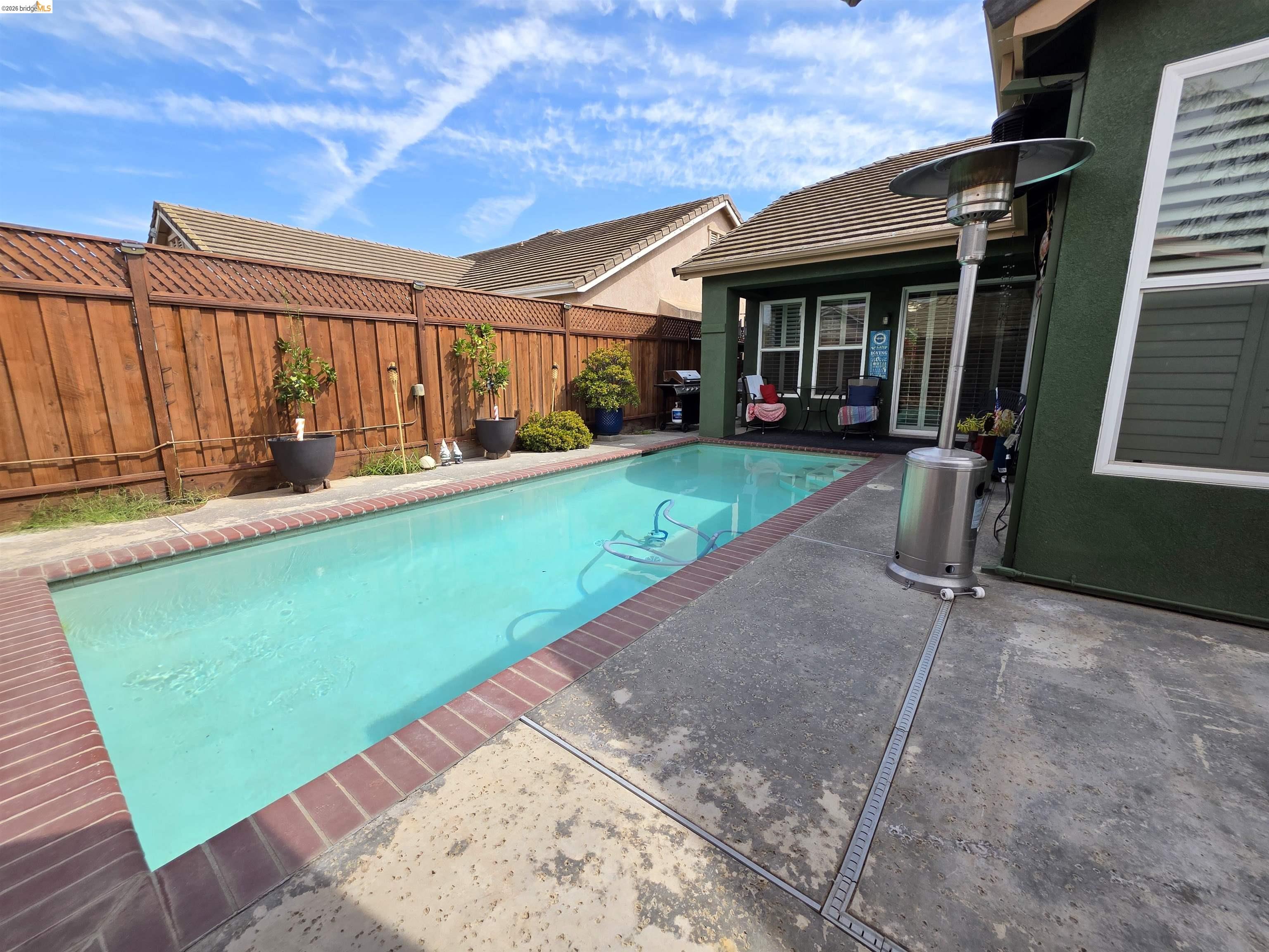 2607 Glow Road Riverbank, CA 95367 - Photo 42 of 42 Rectangular swimming pool with brick coping