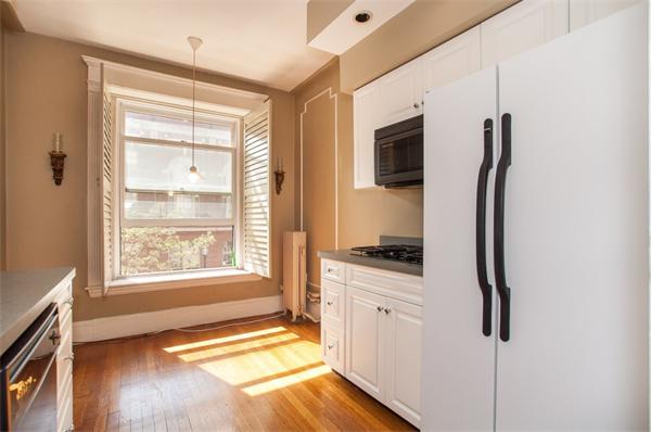 8 Garrison Street, Unit 209 Boston, MA 02116 - Photo 1 of 13 a spacious bathroom with a granite countertop sink and a bathtub