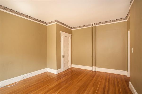 8 Garrison Street, Unit 209 Boston, MA 02116 - Photo 5 of 13 a view of a room with wooden floor and a window