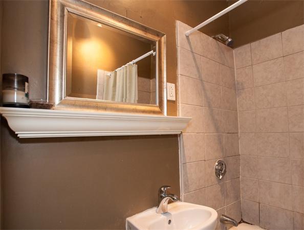 8 Garrison Street, Unit 209 Boston, MA 02116 - Photo 6 of 13 a bathroom with a sink and mirror