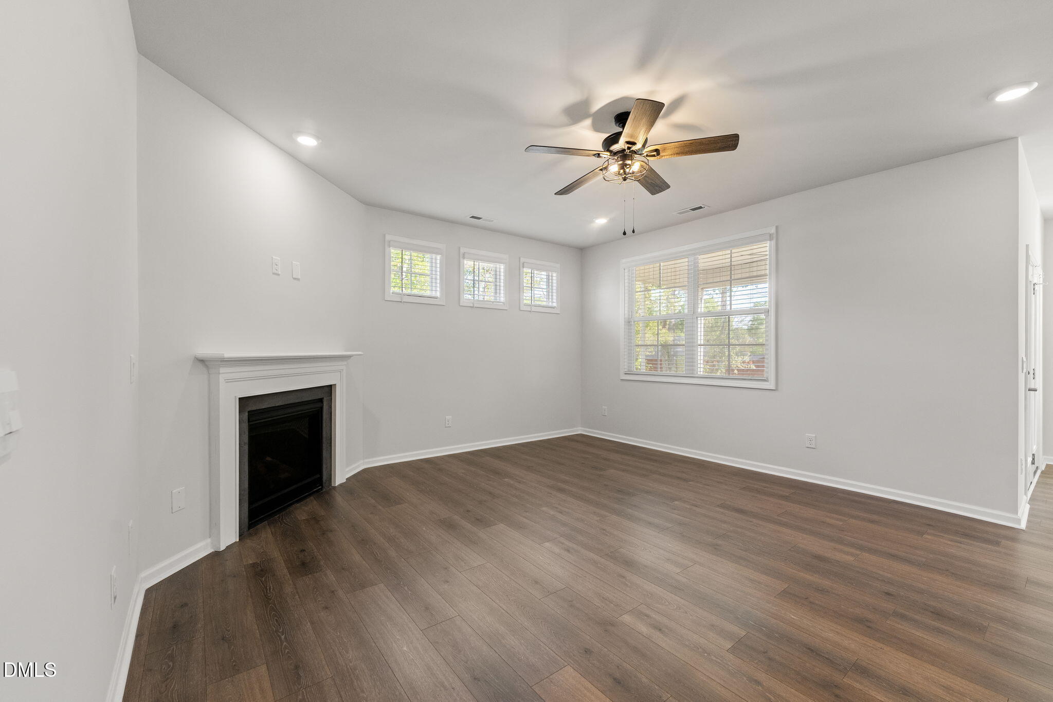 1639 Abberly Place Graham, NC 27253 - Photo 9 of 44 a view of an empty room with a window and fireplace