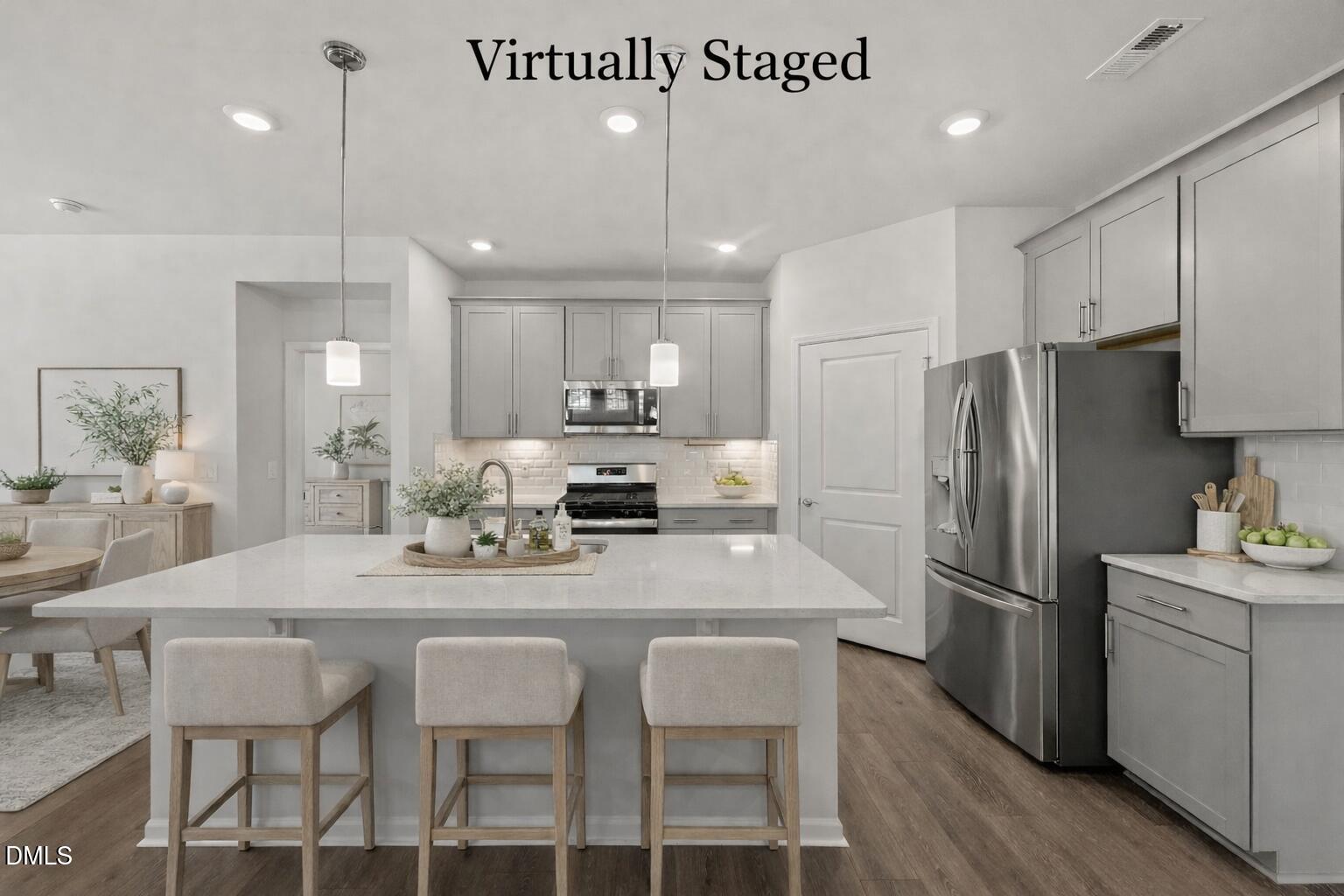 1639 Abberly Place Graham, NC 27253 - Photo 10 of 44 a kitchen with stainless steel appliances granite countertop a dining table chairs refrigerator and microwave