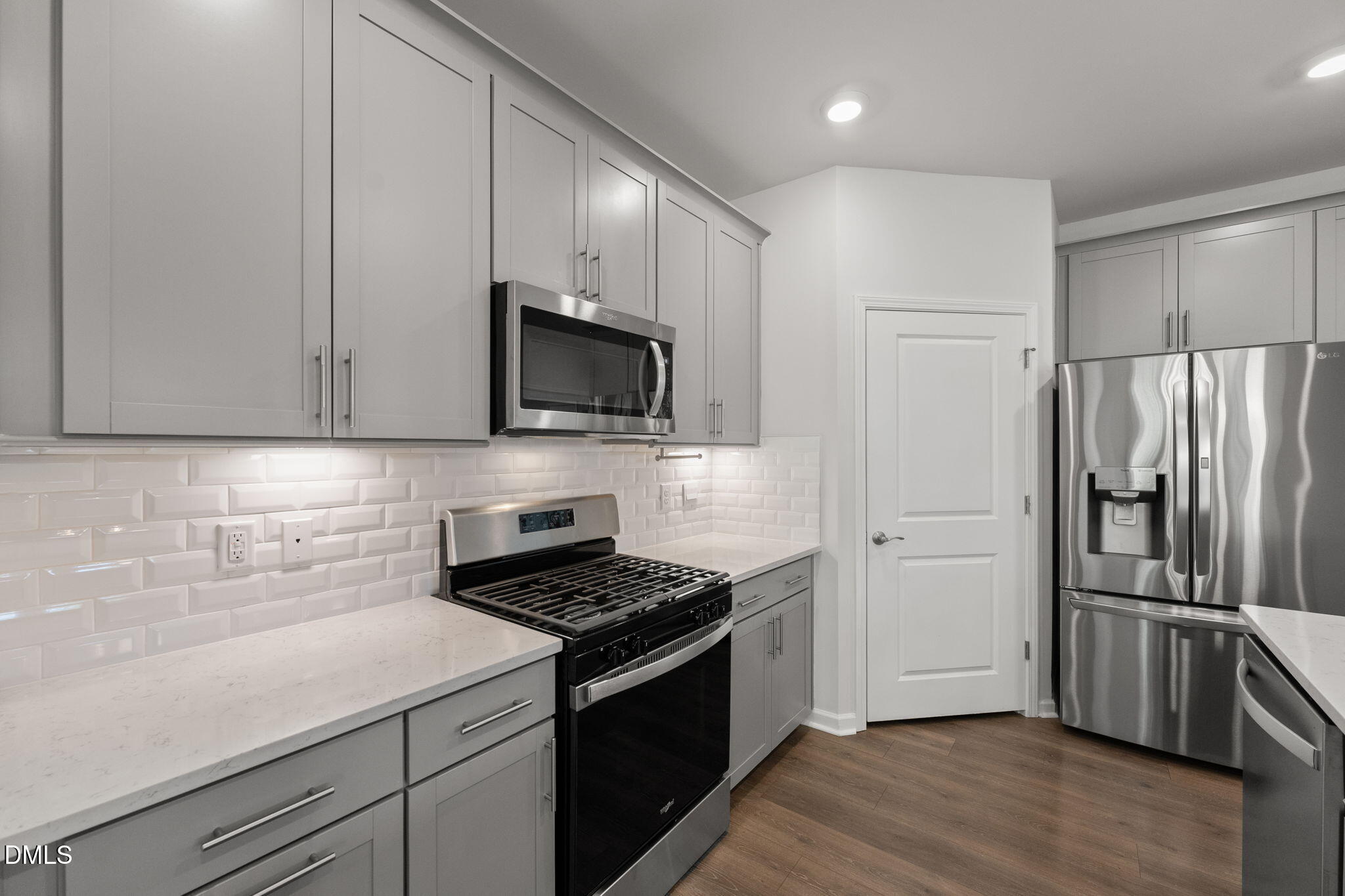 1639 Abberly Place Graham, NC 27253 - Photo 12 of 44 a kitchen with a sink stainless steel appliances and cabinets