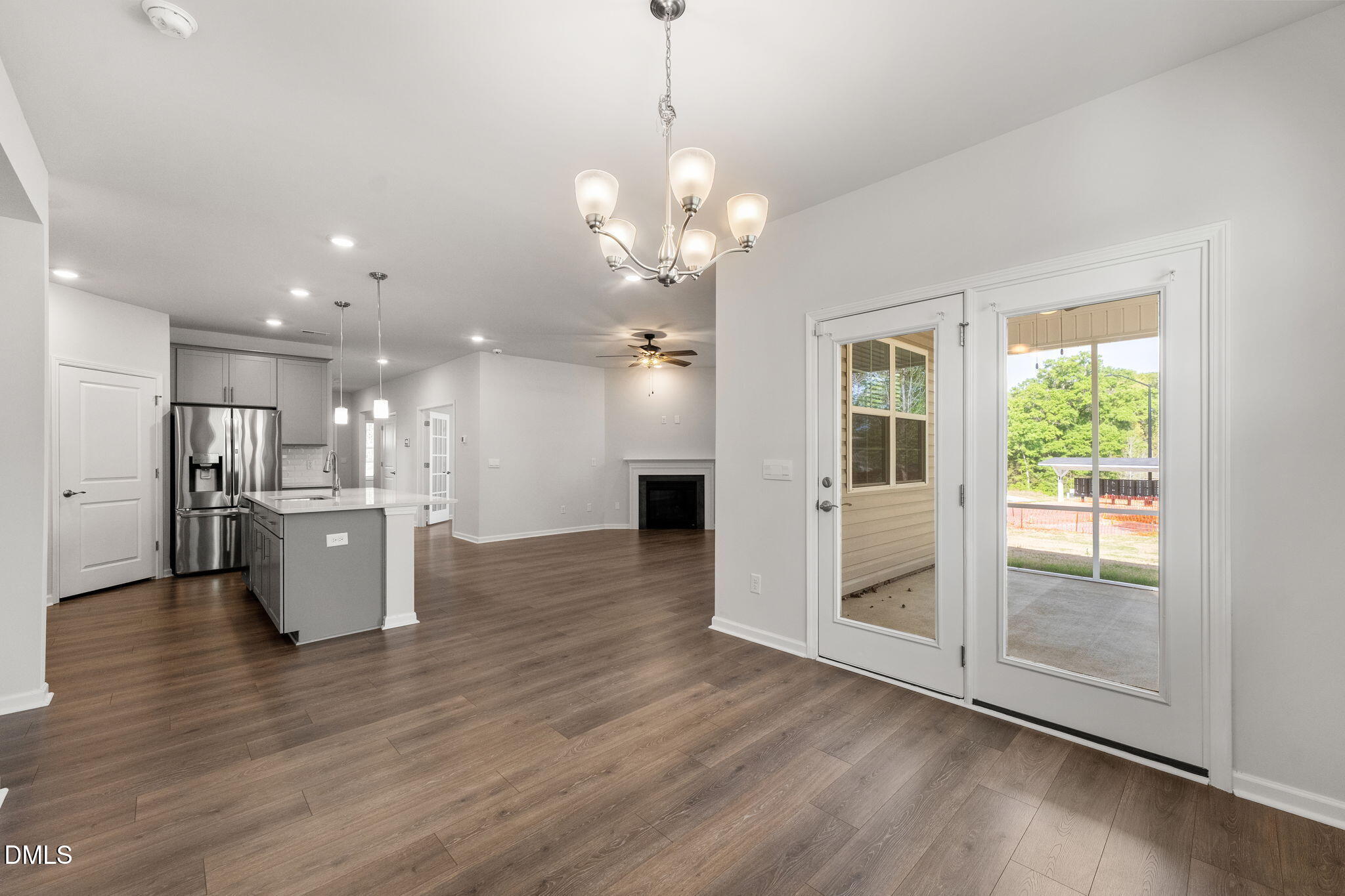 1639 Abberly Place Graham, NC 27253 - Photo 15 of 44 a view of a kitchen and kitchen with a stove wooden floor