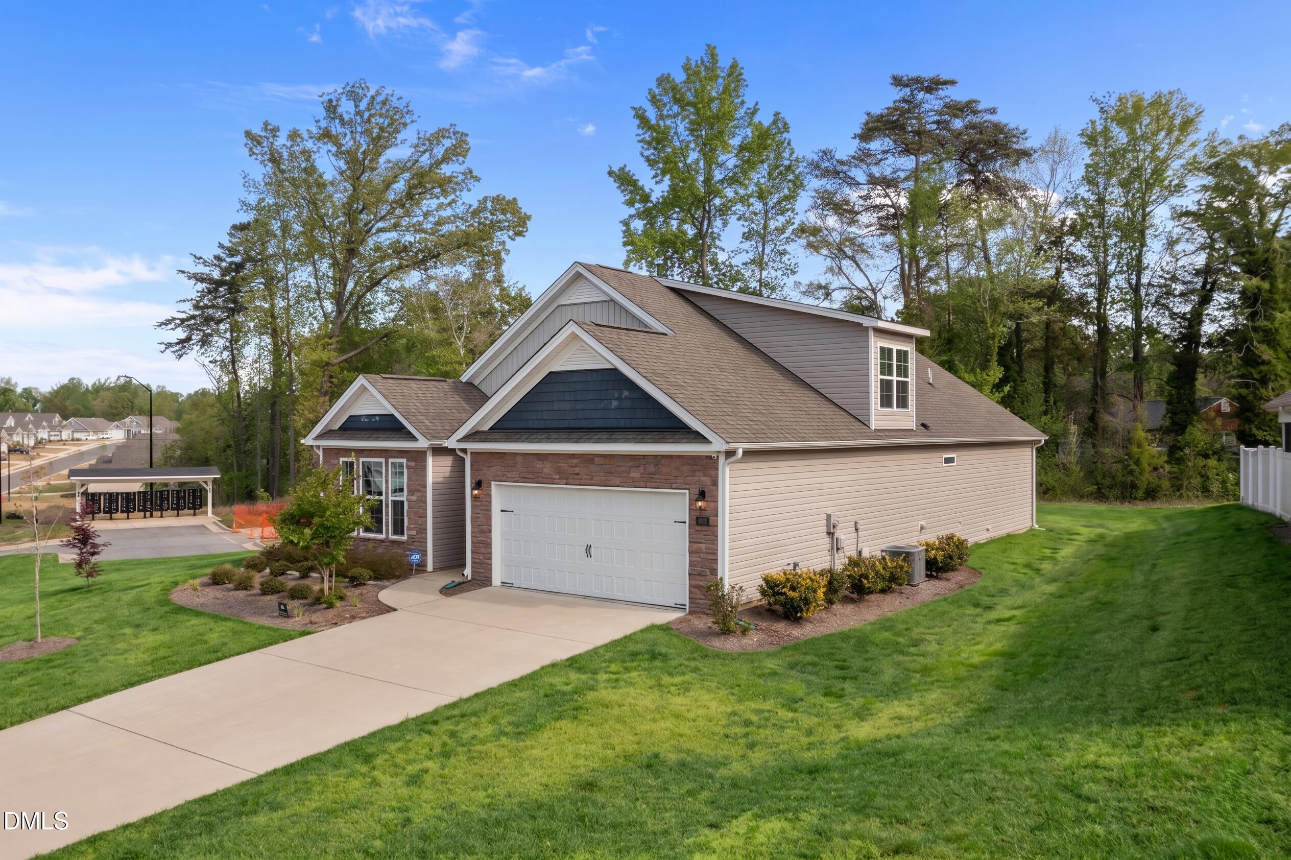 1639 Abberly Place Graham, NC 27253 - Photo 36 of 44 a view of a house with yard and a garden