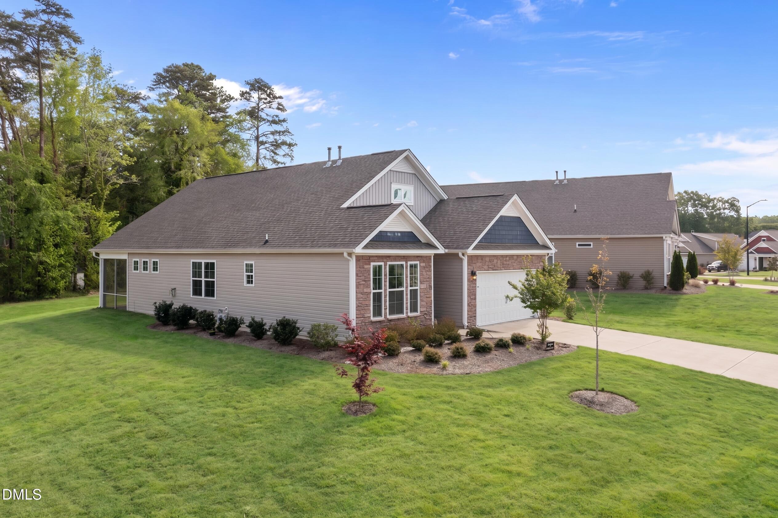 1639 Abberly Place Graham, NC 27253 - Photo 37 of 44 a house view with a garden space