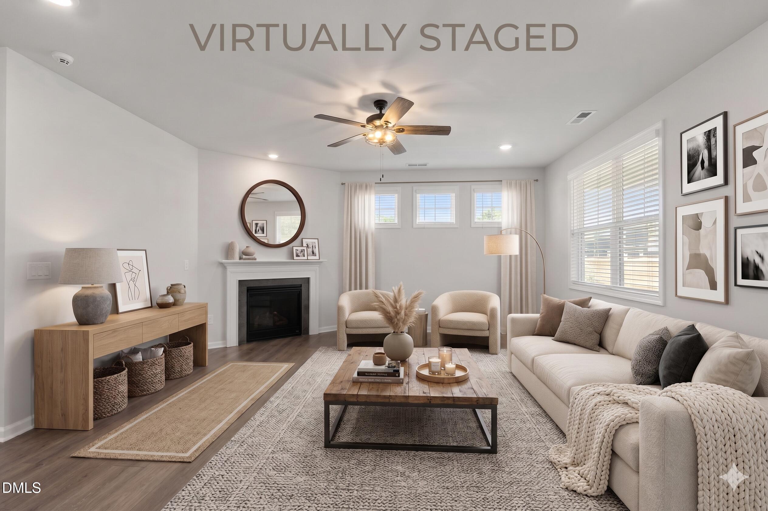 1639 Abberly Place Graham, NC 27253 - Photo 6 of 44 a living room with furniture a fireplace and a large window