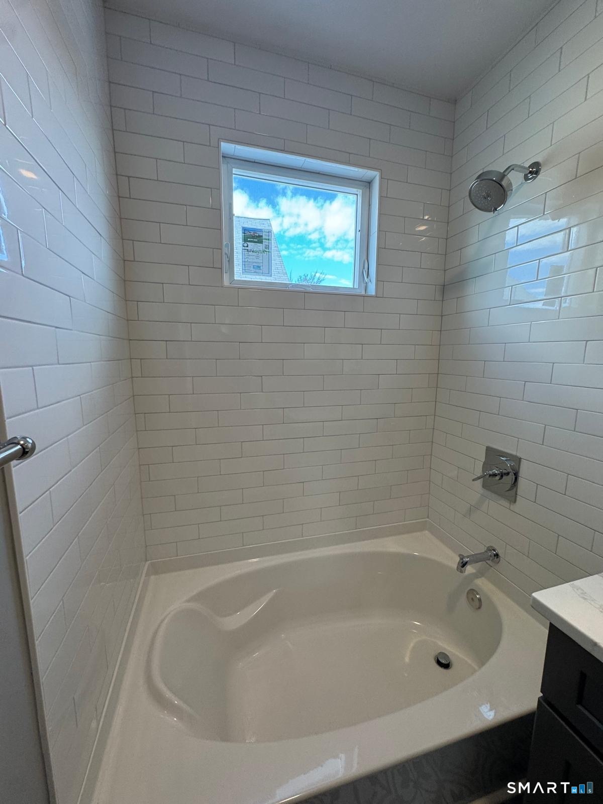 162 Fox Street, Unit 2 Bridgeport, CT 06605 - Photo 15 of 23 a close up of a bathtub in a bathroom