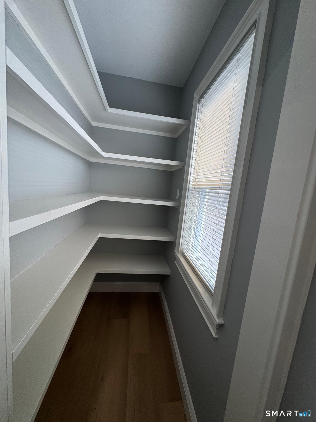 162 Fox Street, Unit 2 Bridgeport, CT 06605 - Photo 17 of 23 a storage room with empty racks