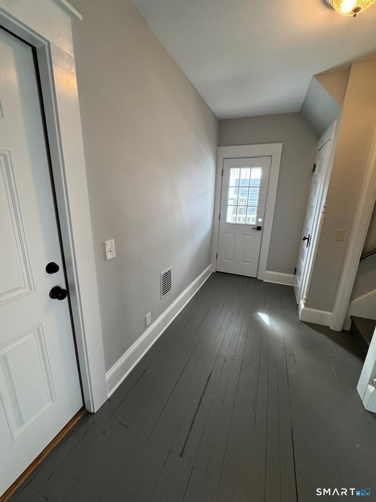 162 Fox Street, Unit 2 Bridgeport, CT 06605 - Photo 23 of 23 an empty room with windows