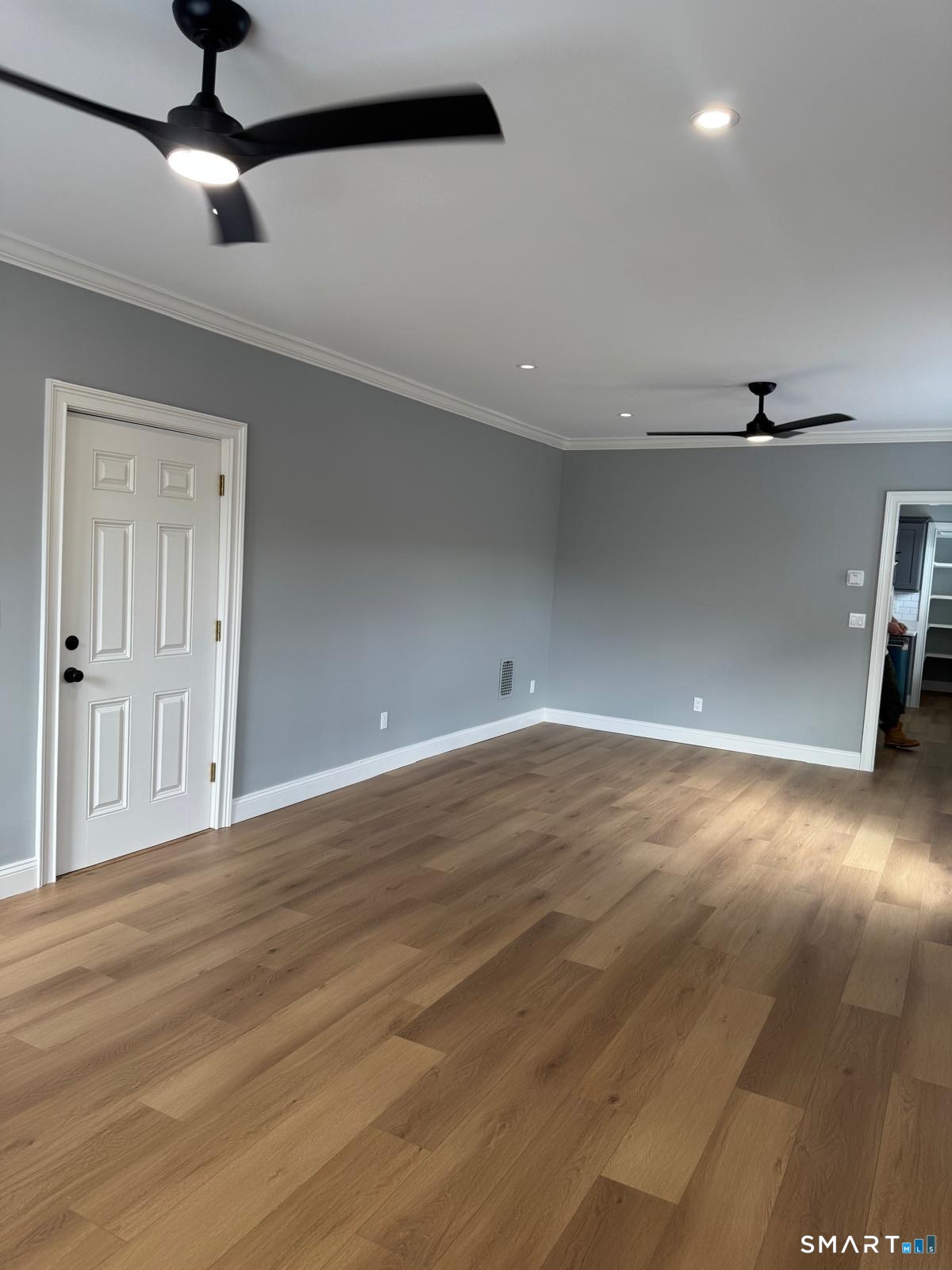 162 Fox Street, Unit 2 Bridgeport, CT 06605 - Photo 8 of 23 a view of a livingroom with a ceiling fan wooden floor and window