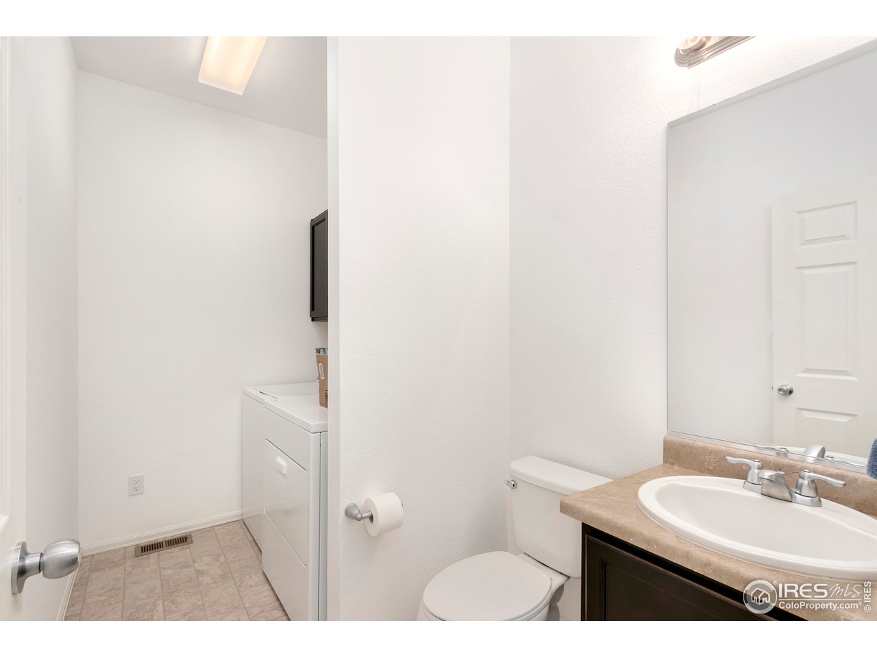 1014 Trading Post Road Fort Collins, CO 80524 - Photo 12 of 24 Main Floor Laundry with Half Bath