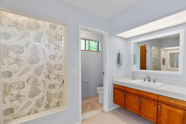 a kitchen with cabinets appliances and a counter space