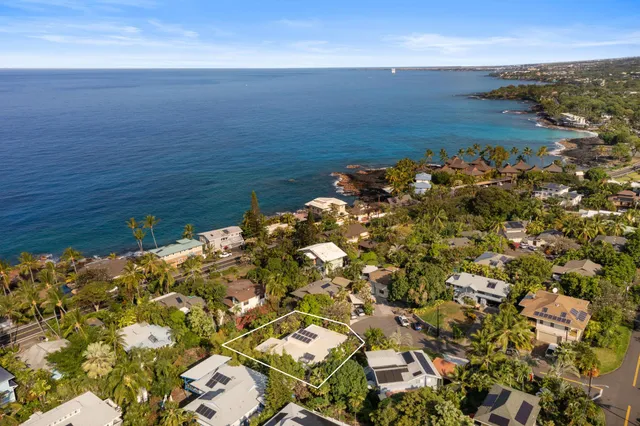 a living room with furniture tv and a large window