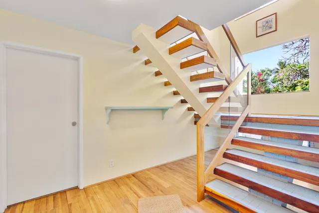 a view of a dining room with furniture and a window