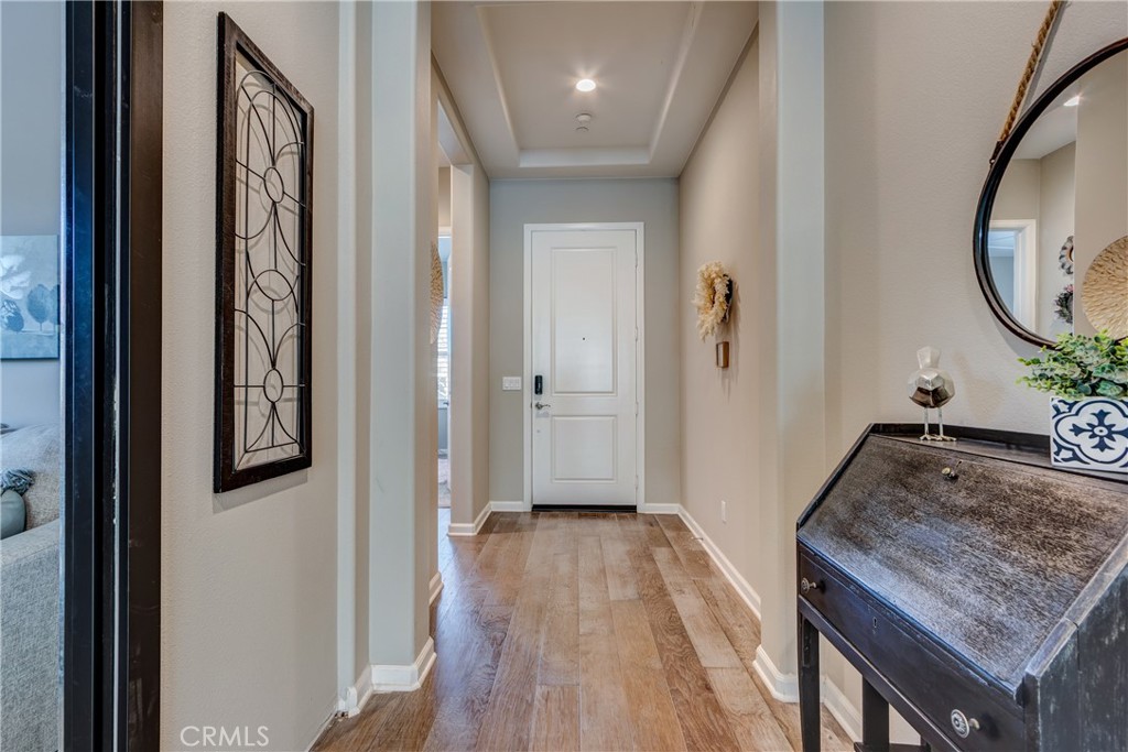 11137 Briar Rose Court Corona, CA 92883 - Photo 10 of 75 a view of a hallway with wooden floor and staircase