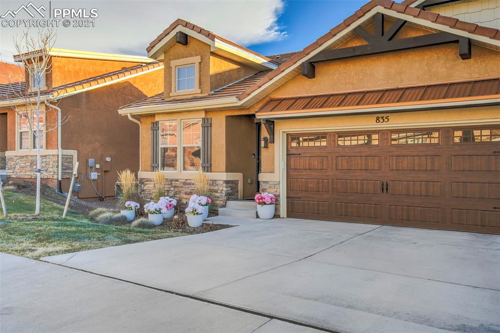 835 Citrine View Colorado Springs, CO 80921 - Photo 2 of 50 a front view of a house with a outdoor space