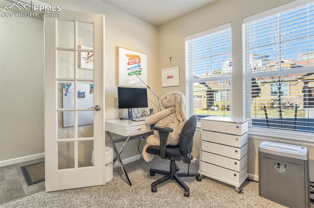 835 Citrine View Colorado Springs, CO 80921 - Photo 20 of 50 a view of a workspace with furniture and a window