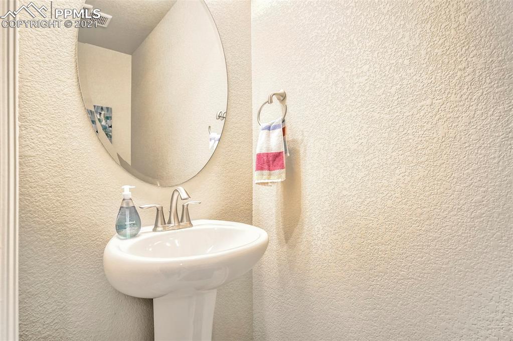 835 Citrine View Colorado Springs, CO 80921 - Photo 23 of 50 a bathroom with a sink and a mirror
