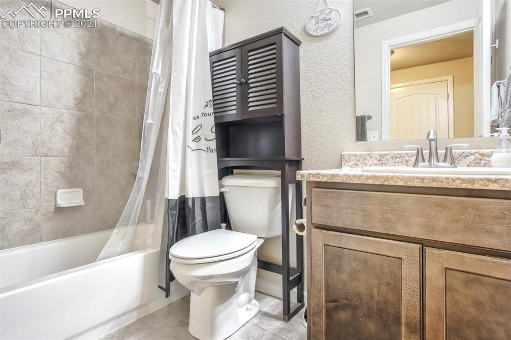 835 Citrine View Colorado Springs, CO 80921 - Photo 26 of 50 a bathroom with a sink toilet and shower