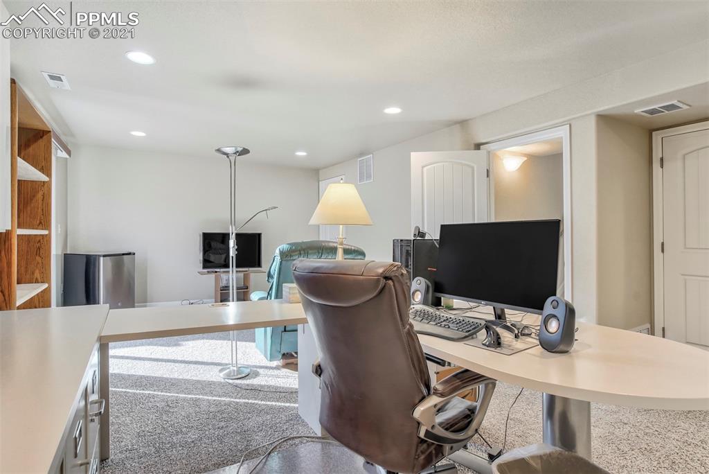 835 Citrine View Colorado Springs, CO 80921 - Photo 32 of 50 a view of a workspace with furniture