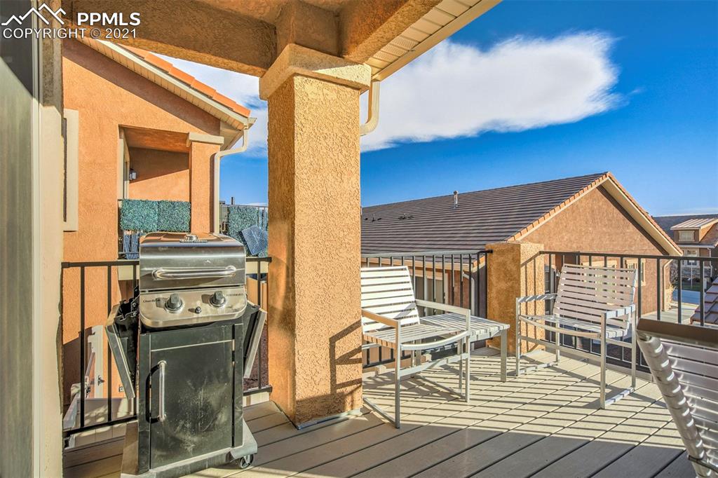 835 Citrine View Colorado Springs, CO 80921 - Photo 42 of 50 a view of a chairs and a table on the wooden roof