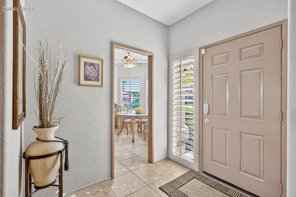 a view of an entryway with wooden floor