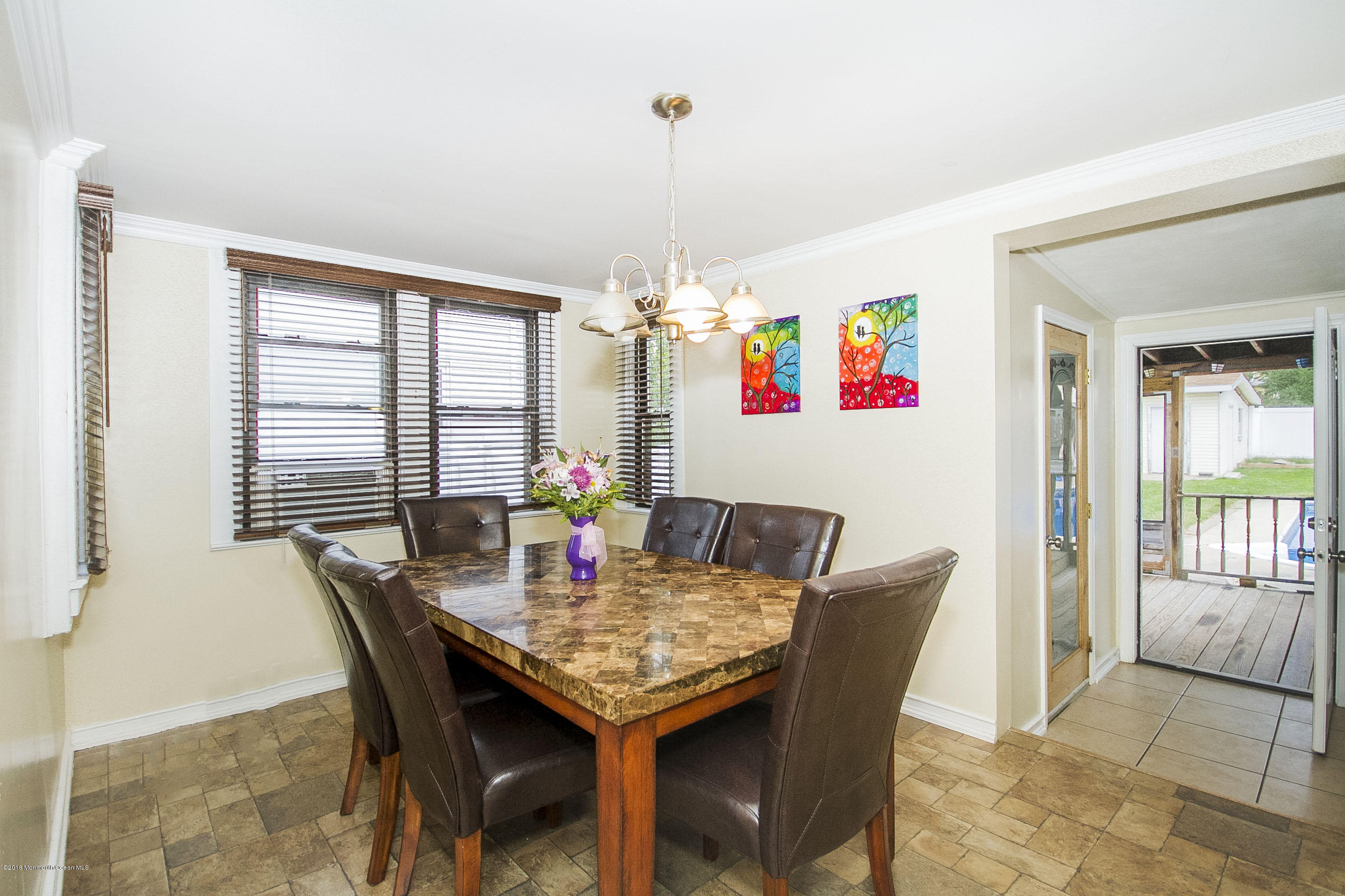 272 Main Street Matawan, NJ 07747 - Photo 15 of 36 a view of a dining room with furniture and chandelier