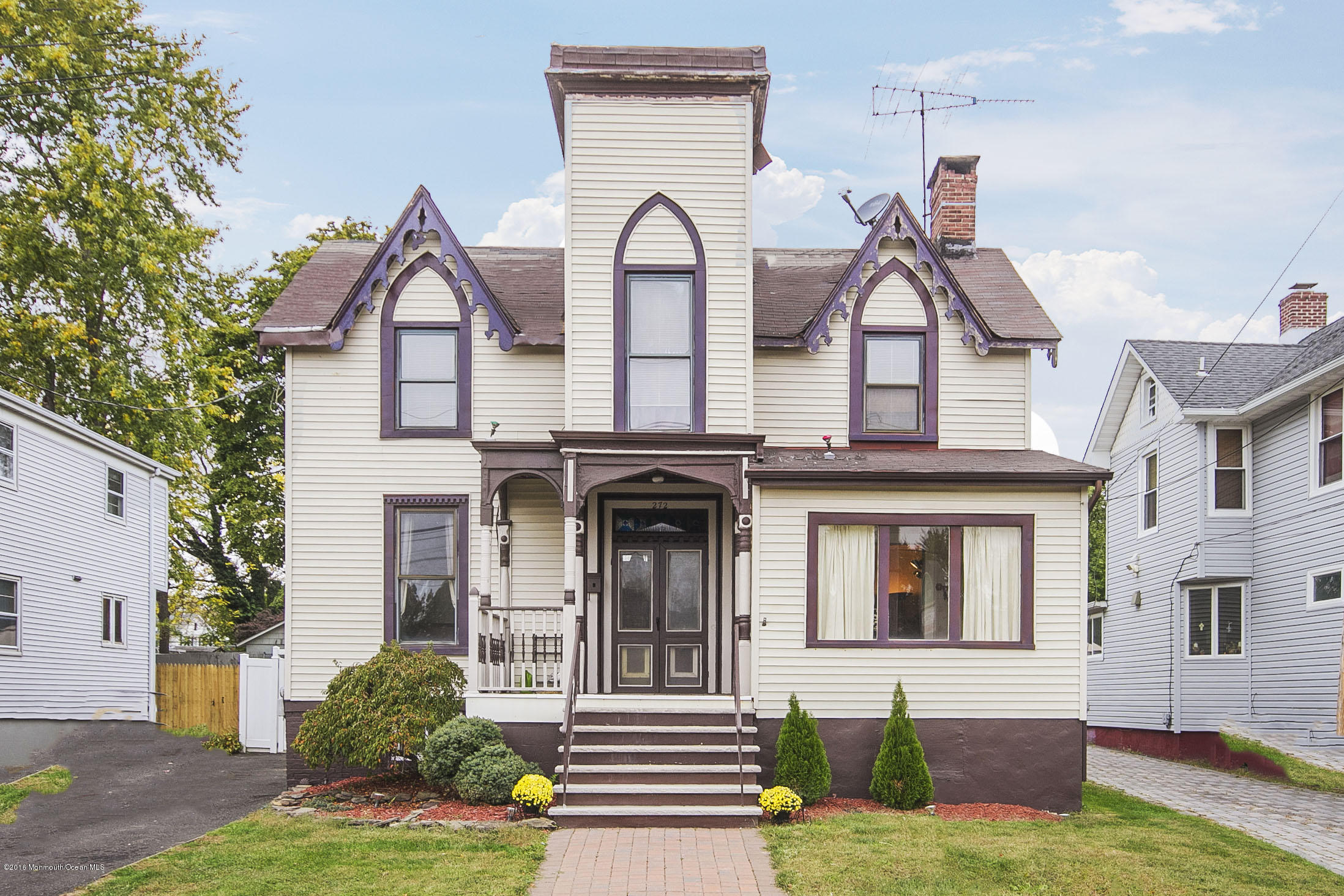 272 Main Street Matawan, NJ 07747 - Photo 2 of 36 a front view of a house with garden