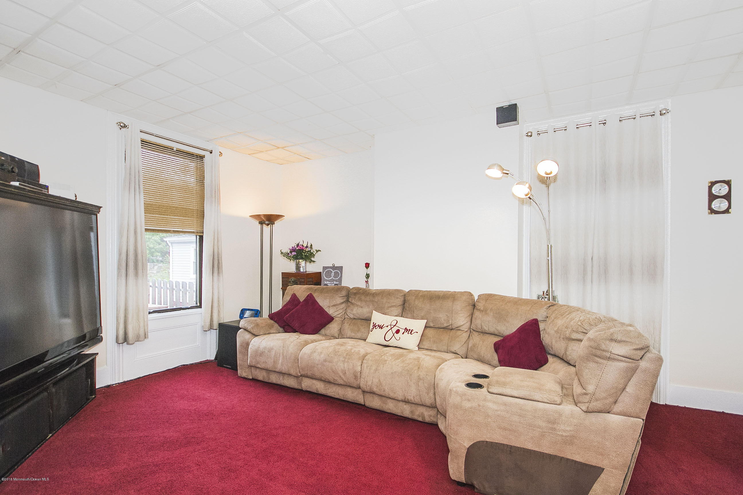 272 Main Street Matawan, NJ 07747 - Photo 22 of 36 a living room with furniture and a flat screen tv