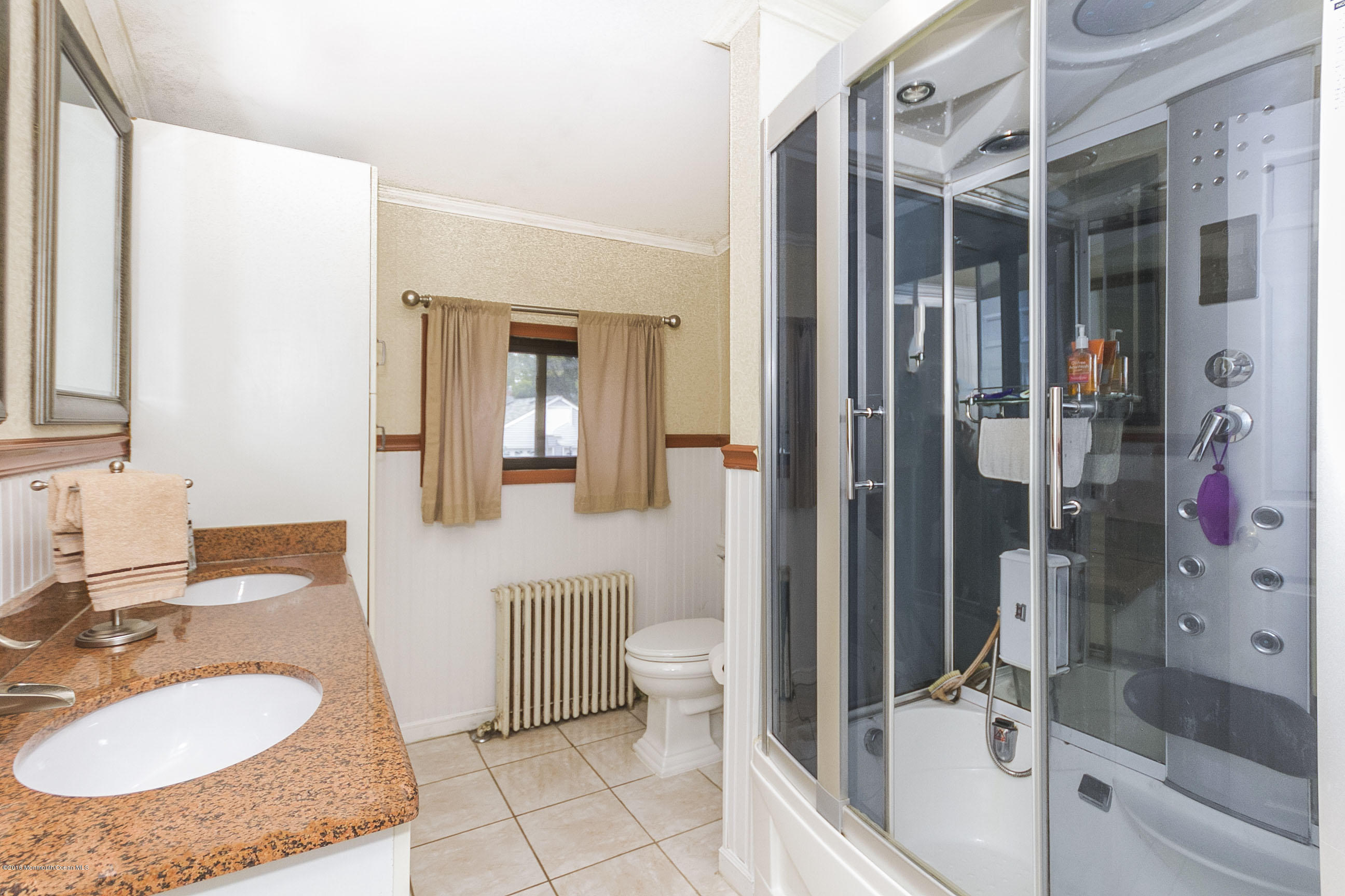 272 Main Street Matawan, NJ 07747 - Photo 27 of 36 a bathroom with a sink toilet and shower