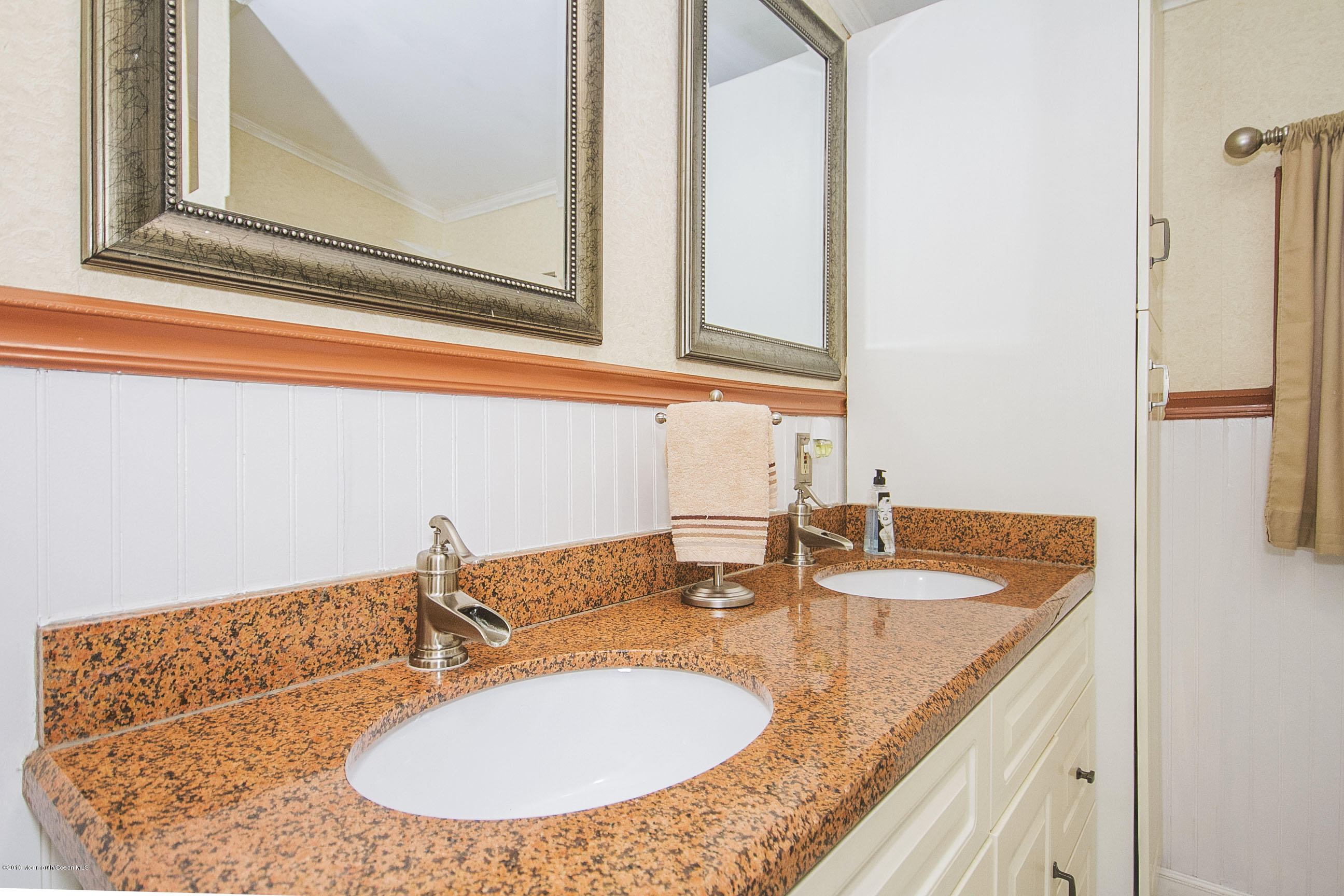 272 Main Street Matawan, NJ 07747 - Photo 29 of 36 a bathroom with a granite countertop sink and a mirror