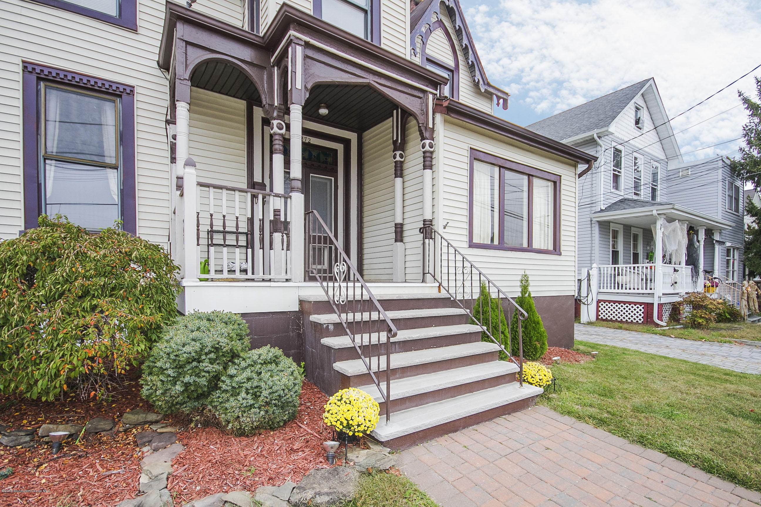 272 Main Street Matawan, NJ 07747 - Photo 3 of 36 a front view of a house with a garden