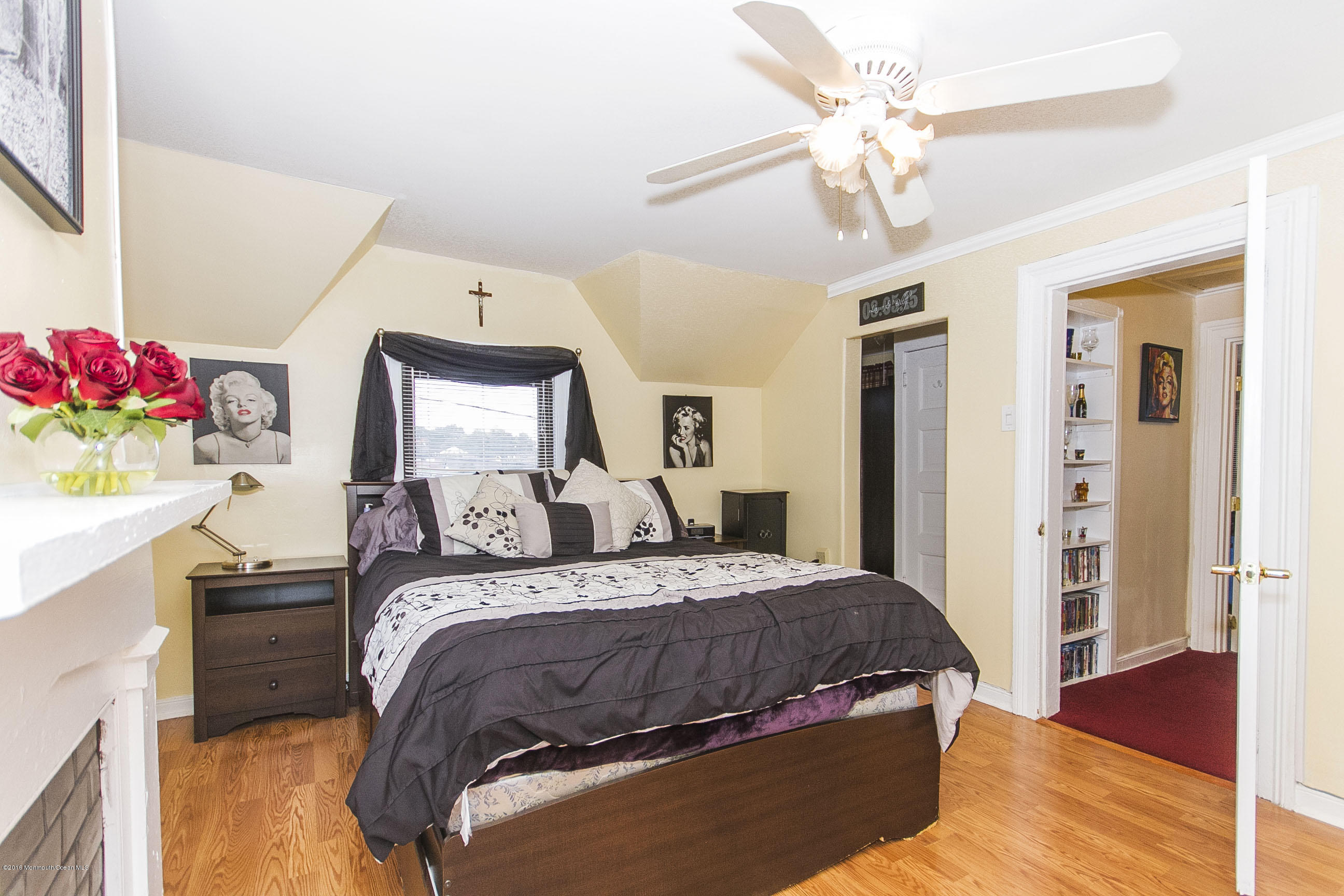 272 Main Street Matawan, NJ 07747 - Photo 33 of 36 a bedroom with a bed and a chandelier