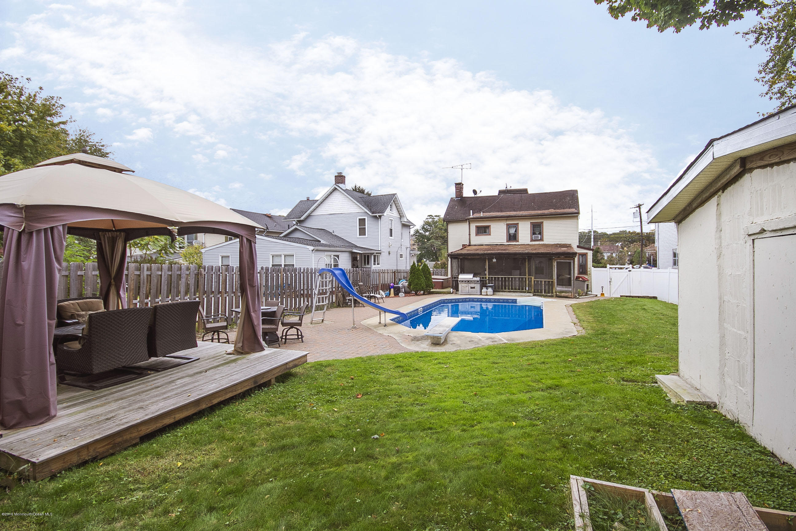 272 Main Street Matawan, NJ 07747 - Photo 9 of 36 a view of a house with swimming pool and a yard