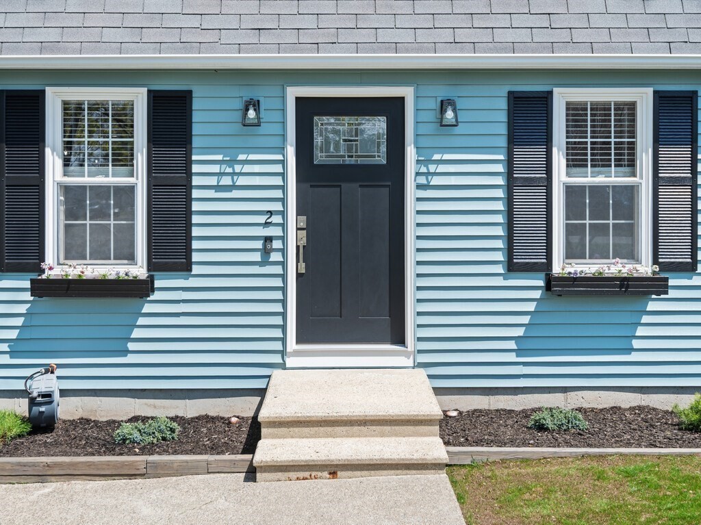 2 Stringer Dam Road Shrewsbury, MA 01545 - Photo 5 of 35 a front view of a house with a yard and garage