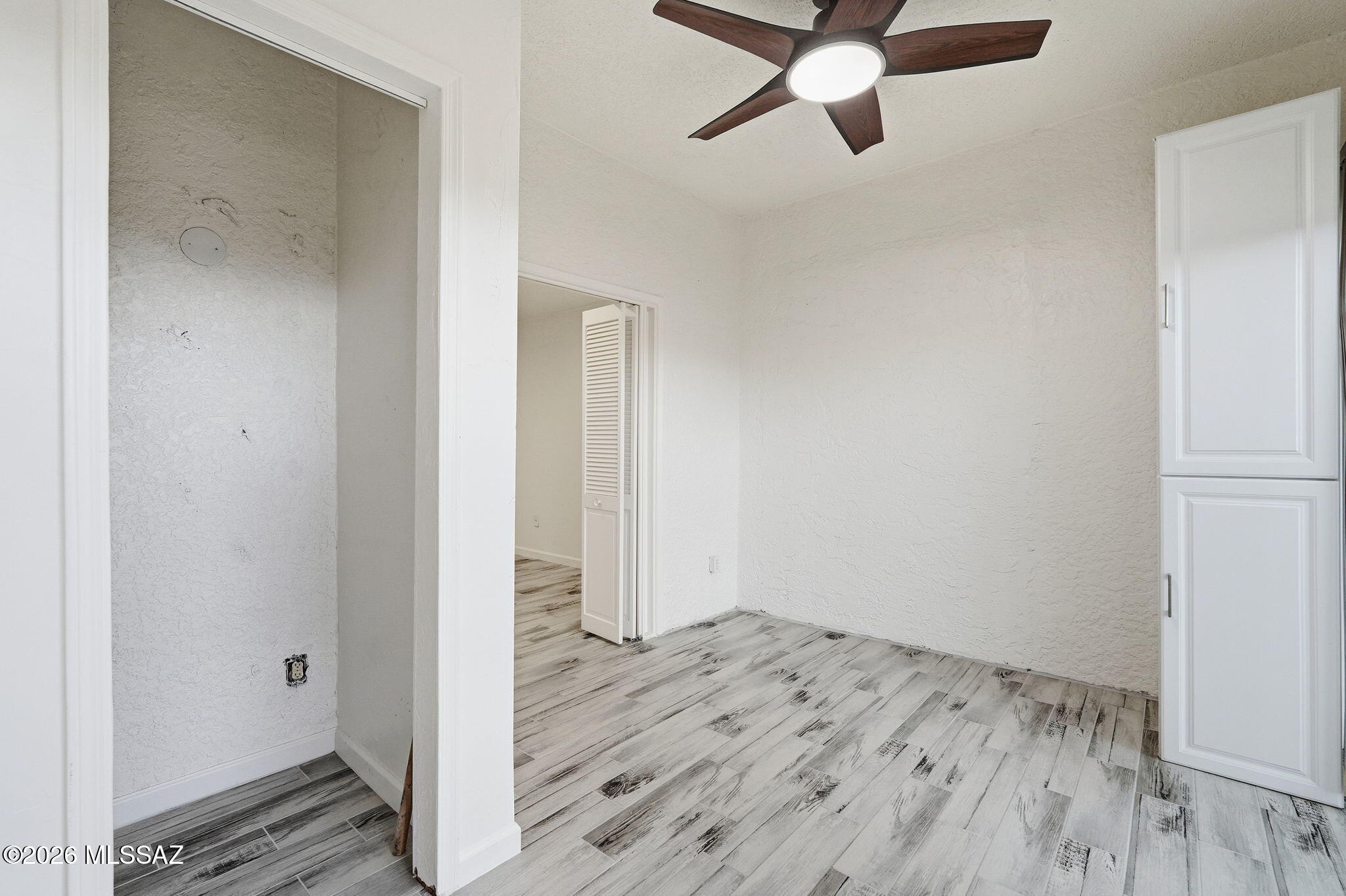 1183 Circulo Canario Rio Rico, AZ 85648 - Photo 15 of 31 a view of empty room with wooden floor