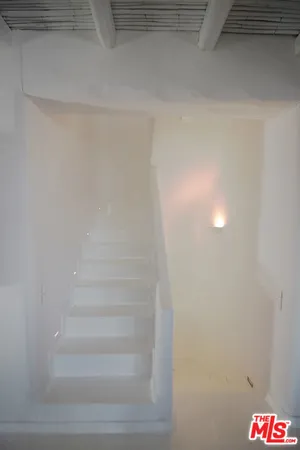 a view of a room with a sink and a fireplace