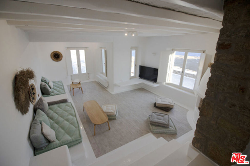 0 East Mykonos Greece undefined, undefined 0 - Photo 34 of 48 a living room with furniture and a fireplace