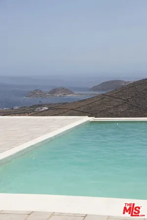 a living room with furniture and a fountain