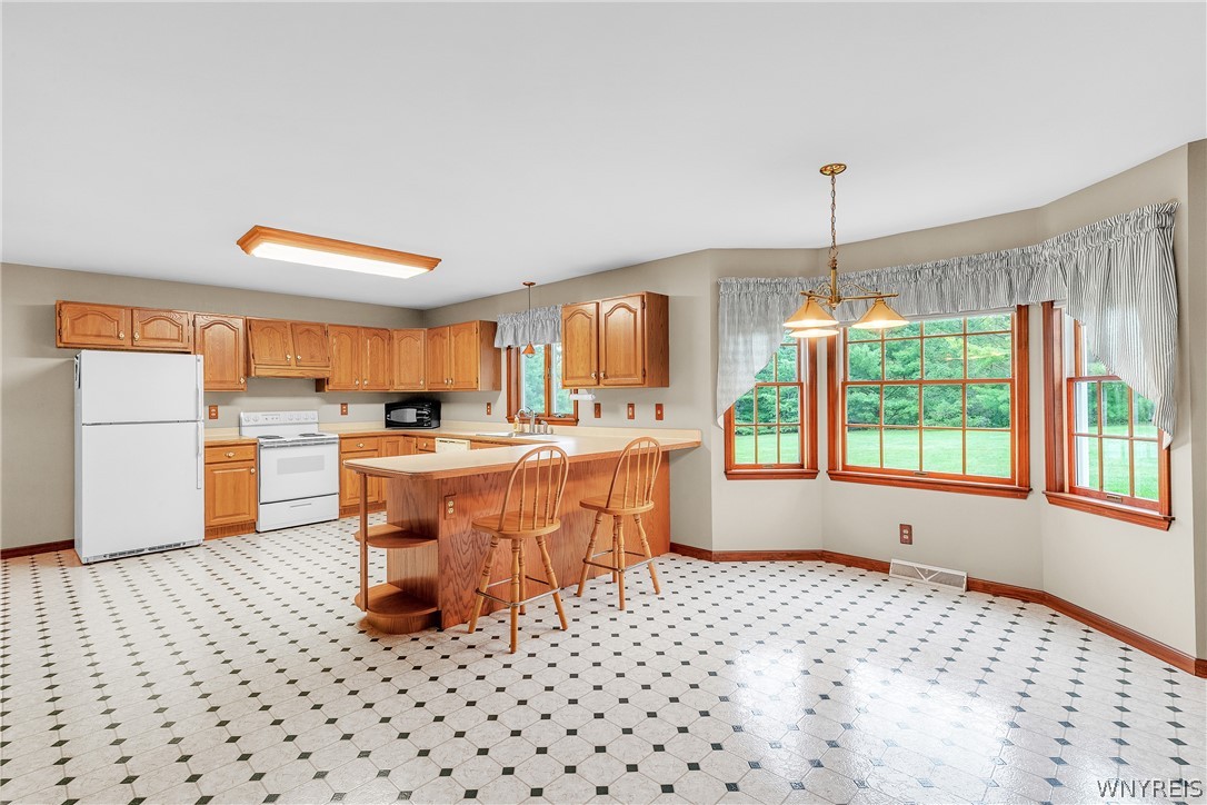 4903 Shawnee Road Cambria, NY 14132 - Photo 11 of 44 Open Kitchen with eat-in Dining area and breakfast
