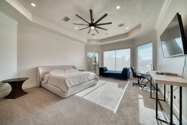 a spacious bathroom with a large tub and shower
